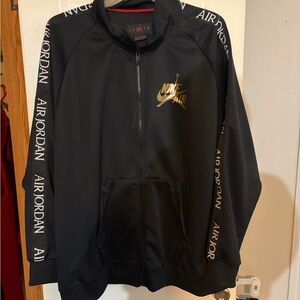 Nike Black Jacket with Gold Logo and Air Jordan Sleeves